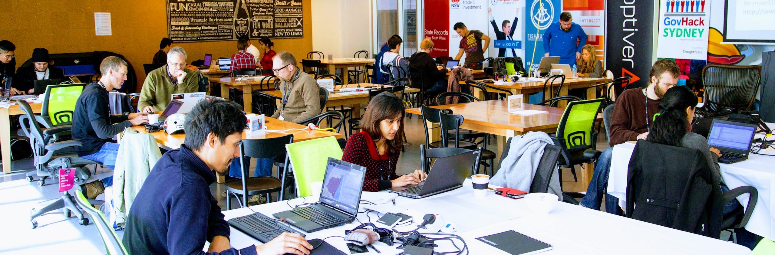 GovHack participants working on laptops